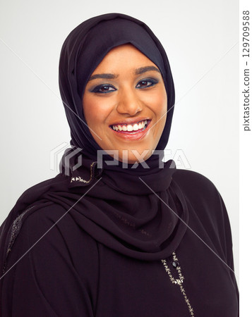 Islamic woman, smile portrait and hijab for religious fashion, culture clothes and happiness n white background. Muslim girl, face and happy, religion head scarf and Arabic beauty isolated in studio 129709588