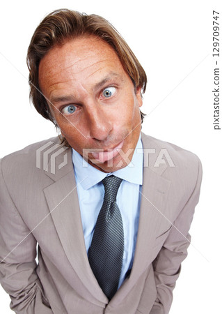 Funny, comic and portrait of a business man with a silly face and a suit with white background. Crazy, joke and comedy of a model executive isolated with funny face and humor being goofy for work 129709747