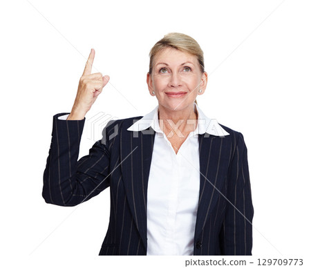 Senior business woman, smile and pointing finger up in white background for suggestions, product placement and mockup. Elderly person, happy face and corporate manager hand gesture isolated in studio 129709773