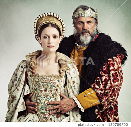 Crown, queen and king in costume isolated on studio background for medieval, renaissance and England culture. Headshot portrait of royal couple with power, wealth and vintage fashion for power Crown, queen and king in costume isolated on studio background for medieval, renaissance and England culture. Headshot portrait of royal couple with power, wealth and vintage fashion for power 129709790