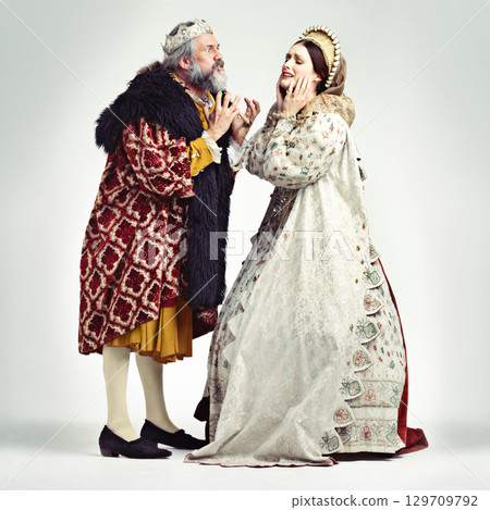 Royalty, renaissance and a king arguing with his queen in studio on a gray background for leadership of the monarchy. Couple, crown and history with a ruler and his wife fighting over the kingdom Royalty, renaissance and a king arguing with his queen in studio on a gray background for leadership of the monarchy. Couple, crown and history with a ruler and his wife fighting over the kingdom 129709792