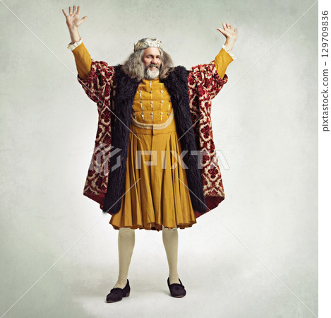 Royal king man, studio and hands in air for power, magic or winning celebration by gray background. Ancient medieval leader, portrait and full body with fantasy, happiness or vintage robe by backdrop Royal king man, studio and hands in air for power, magic or winning celebration by gray background. Ancient medieval leader, portrait and full body with fantasy, happiness or vintage robe by backdrop 129709836