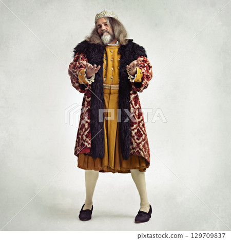 Royalty, king and portrait of man in studio isolated on a gray background mock up. Retro victorian, vintage crown and leadership of mature, proud and confident male regal ruler from United Kingdom 129709837