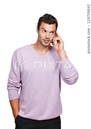 Man, phone call conversation and thinking in studio for online discussion, mobile communication and talking in white background. Person, standing casual and speaking on smartphone isolated in studio 129709842