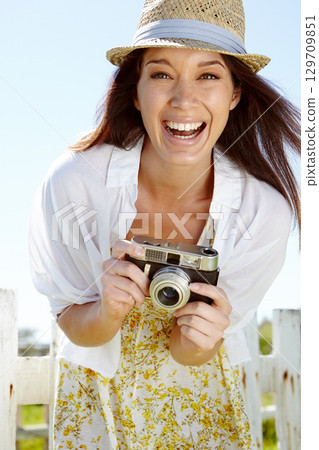 Laughing photographer, portrait or happy woman and digital camera on holiday or summer vacation in Italy. Smile, face or travel vlogger with vintage photography for tourist influencer in nature 129709851