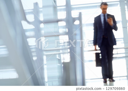 Blurred, travel or business man with phone for invest strategy, finance growth or financial review. CEO, airport or manager with smartphone for planning, data analysis or economy data web research 129709860