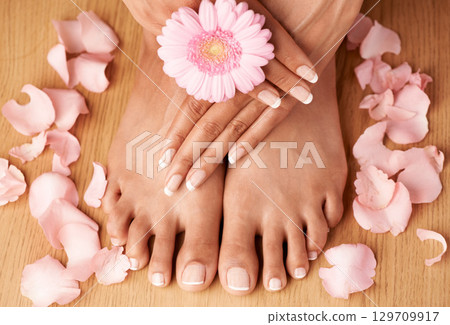 Relax, hands and feet of black woman with flower petals for luxury cosmetic treatment with manicure and pedicure nails. Healthy skincare of girl with daisy for beauty spa and wellness zoom. Relax, hands and feet of black woman with flower petals for luxury cosmetic treatment with manicure and pedicure nails. Healthy skincare of girl with daisy for beauty spa and wellness zoom. 129709917