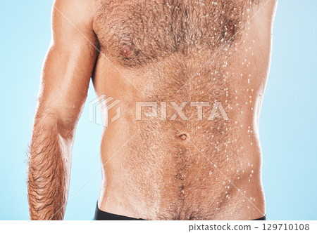 Health, beauty and body care man shower skincare for washing routine and cosmetic treatment campaign. Grooming, wellness and hygiene of muscular model cleaning body in blue studio background 129710108