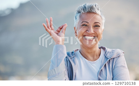 Elderly woman, portrait and OK hand in nature for exercise, training or workout success, trust and healthy lifestyle promotion. Yes sign, happy and retirement old woman for sports or wellness journey 129710138
