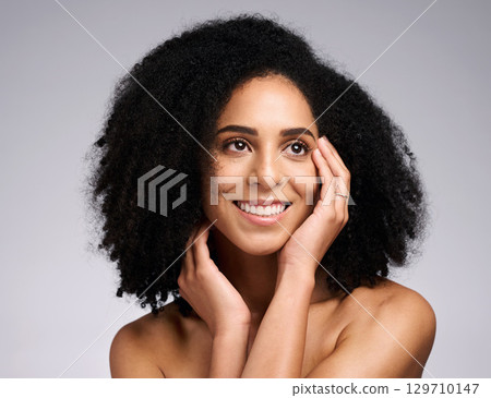 Black woman, beauty and face skincare with a smile, glow and happiness for clean skin on grey studio background. Aesthetic model with afro hair and dermatology, cosmetic and makeup for facial results Black woman, beauty and face skincare with a smile, glow and happiness for clean skin on grey studio background. Aesthetic model with afro hair and dermatology, cosmetic and makeup for facial results 129710147