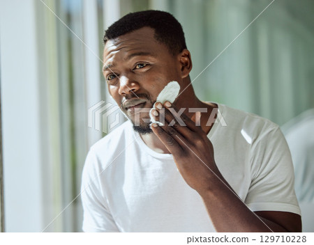 Beauty skincare, bathroom and black man with cream for luxury healthcare, morning wellness routine or facial acne prevention. Spa salon cosmetics, dermatology and person with face collagen product 129710228