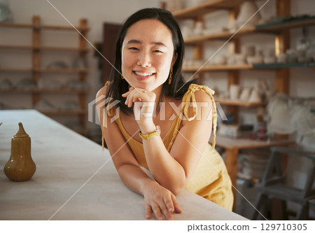 Asian woman, success portrait and ceramic workshop or art studio for product manufacturing, sculpture artist and creativity retail store. Pottery, artistic woman face and happy creative artwork Asian woman, success portrait and ceramic workshop or art studio for product manufacturing, sculpture artist and creativity retail store. Pottery, artistic woman face and happy creative artwork 129710305