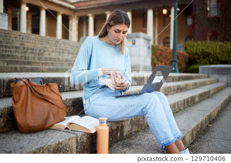 College, learning and sandwich with woman and laptop for education, lunch break and academy research. University, knowledge and goal with girl student and food on stairs of campus for relax and study College, learning and sandwich with woman and laptop for education, lunch break and academy research. University, knowledge and goal with girl student and food on stairs of campus for relax and study 129710406