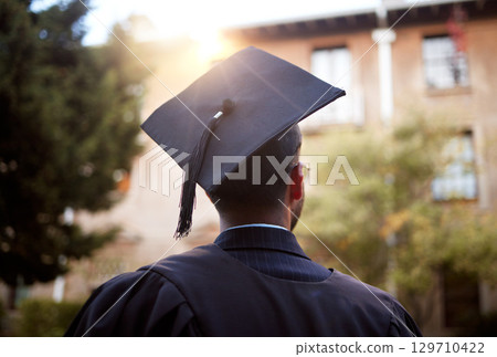 Black man, graduation and ideas at university building, school and college with employment opportunity goal. Thinking student, graduate and hope in graduation cap, ceremony and education event Black man, graduation and ideas at university building, school and college with employment opportunity goal. Thinking student, graduate and hope in graduation cap, ceremony and education event 129710422