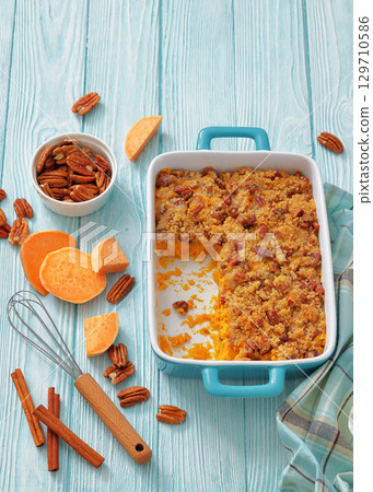 sweet potato casserole with pecan streusel topping 129710586