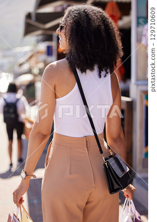 Happy young woman, shopping bags or retail city fashion for luxury clothes, self care spree or luxury mall sales. Smile, fun or trendy customer gifts in Brazilian urban street or relax street market Happy young woman, shopping bags or retail city fashion for luxury clothes, self care spree or luxury mall sales. Smile, fun or trendy customer gifts in Brazilian urban street or relax street market 129710609