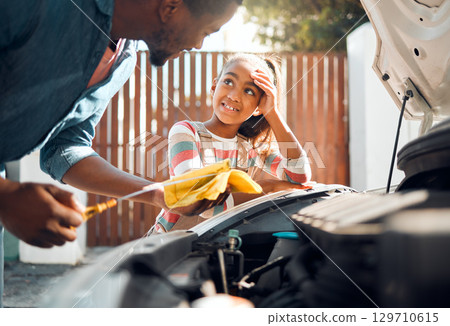 Car problem, child and dad working as a mechanic while teaching daughter to change motor oil and fix vehicle. Black man and girl kid learning, talking and bonding while busy on engine for transport 129710615