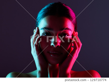 Beauty, neon shadow light and portrait of woman with dark lighting, facial cosmetics and skincare glow. Luxury studio makeup, aesthetic creativity and face model with creative pink blue color design 129710774
