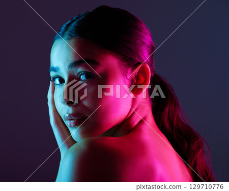 Beauty, neon shadow light and portrait of woman with dark lighting, facial cosmetics and skincare glow. Luxury studio makeup, aesthetic creativity and face model with creative pink blue color design Beauty, neon shadow light and portrait of woman with dark lighting, facial cosmetics and skincare glow. Luxury studio makeup, aesthetic creativity and face model with creative pink blue color design 129710776