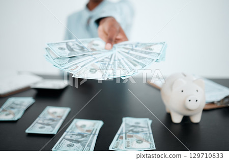 Hand, dollars and black woman with money for payment, financial investment or bribe in office. Currency, finance or business woman offering cash for banking, deal or savings, loan or money laundering Hand, dollars and black woman with money for payment, financial investment or bribe in office. Currency, finance or business woman offering cash for banking, deal or savings, loan or money laundering 129710833