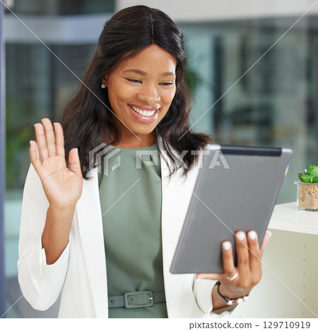 Tablet, wave and video call with a business black woman at work in her office for an online meeting. Communication, networking and internet with a female employee waving during a wireless chat Tablet, wave and video call with a business black woman at work in her office for an online meeting. Communication, networking and internet with a female employee waving during a wireless chat 129710919