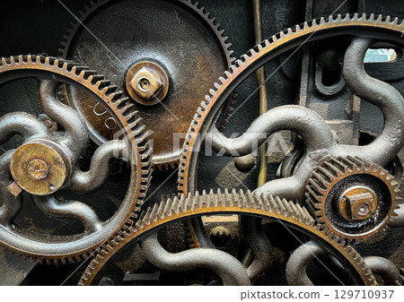 old cogs in vintage machinery - industrial closeup, abstract industry background, 129710937