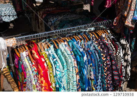 colorful vintage clothings on fashion flea market - second hand clothes , 129710938