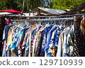 second hand clothes, colorful vintage clothings on fashion flea market 129710939