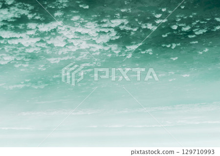 Sky and clouds background from above on Earth 129710993