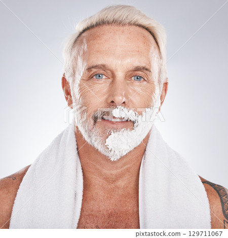 Man, face and grooming shaving cream in self care maintenance or beauty aesthetic on gray studio background. Portrait, happy smile and mature model with hair removal foam in skincare facial cleaning Man, face and grooming shaving cream in self care maintenance or beauty aesthetic on gray studio background. Portrait, happy smile and mature model with hair removal foam in skincare facial cleaning 129711067