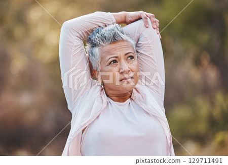 Fitness, stretching or old woman in nature thinking of body goals starts training, exercise or workout in New Zealand. Wellness, relax or healthy senior person with motivation, resilience or vision 129711491