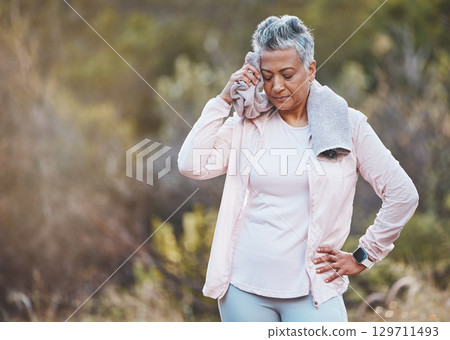 Senior woman, tired and towel for sweating at park after training or workout mock up. Sports fitness, break and fatigue, exhausted and elderly female wipe sweat with fabric after exercise outdoors. 129711493