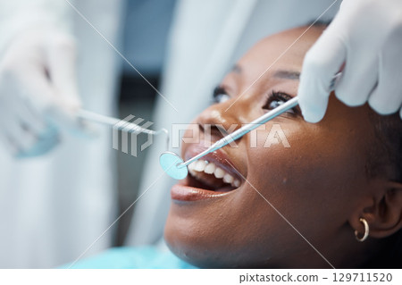 Black woman, mouth and face with dentist, tools in hands and dental, teeth check for healthcare with tooth decay. Tooth surgery, orthodontics and smile, teeth whitening, closeup and Invisalign Black woman, mouth and face with dentist, tools in hands and dental, teeth check for healthcare with tooth decay. Tooth surgery, orthodontics and smile, teeth whitening, closeup and Invisalign 129711520