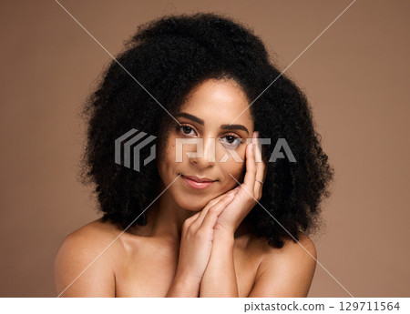 Skincare, aesthetic and portrait of black woman in studio for wellness, healthy and glowing skin. Dermatology, luxury spa and hands on girl face for cosmetics, beauty products and facial treatment Skincare, aesthetic and portrait of black woman in studio for wellness, healthy and glowing skin. Dermatology, luxury spa and hands on girl face for cosmetics, beauty products and facial treatment 129711564