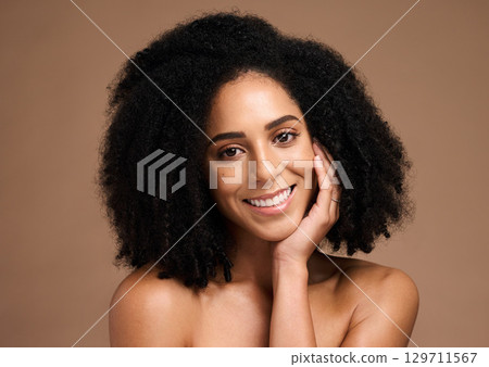 Black woman, happiness portrait and skincare beauty afro hair care wellness, face glow and natural cosmetics dermatology in brown background studio. African model, smile and salon spa facial headshot Black woman, happiness portrait and skincare beauty afro hair care wellness, face glow and natural cosmetics dermatology in brown background studio. African model, smile and salon spa facial headshot 129711567