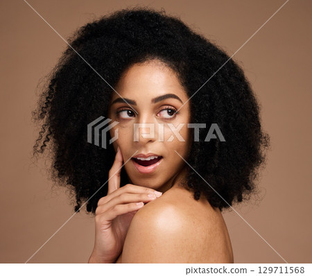 Face, beauty skincare and thinking black woman in studio isolated on a brown background. Makeup, cosmetics and surprised or shocked young female model with idea for spa facial treatment and wellness. Face, beauty skincare and thinking black woman in studio isolated on a brown background. Makeup, cosmetics and surprised or shocked young female model with idea for spa facial treatment and wellness. 129711568