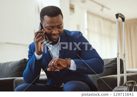 African businessman in hotel, on smartphone call and checking wrist watch for time. Corporate professional in Chicago, young black entrepreneur and listening to voice message in luxury airport African businessman in hotel, on smartphone call and checking wrist watch for time. Corporate professional in Chicago, young black entrepreneur and listening to voice message in luxury airport 129711641
