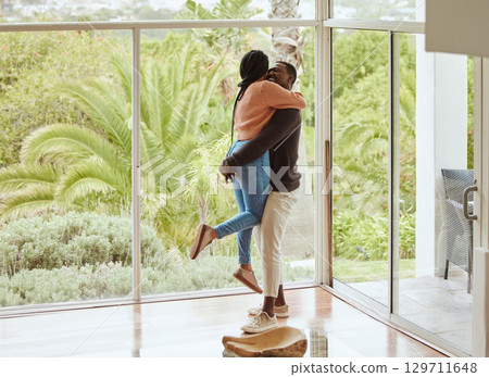 Black couple, hug and love while happy together in their new house with love and happiness to celebrate anniversary or home. Young man and woman with support, care and joy in a healthy marriage Black couple, hug and love while happy together in their new house with love and happiness to celebrate anniversary or home. Young man and woman with support, care and joy in a healthy marriage 129711648