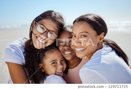 Black family, summer and kids portrait at ocean with mom enjoying USA vacation in sunshine. Love, care and happy family hug together with joyful smile on holiday break at sunny beach. Black family, summer and kids portrait at ocean with mom enjoying USA vacation in sunshine. Love, care and happy family hug together with joyful smile on holiday break at sunny beach. 129711725
