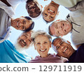 Portrait, senior or friends with fitness goals, support or hope in huddle bonding in training, sports exercise or workout. Low angle, faces or happy elderly people with mission, team work or vision 129711919