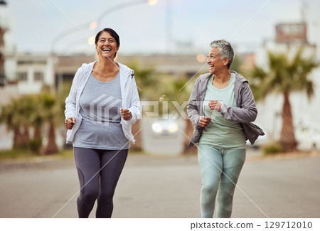 Fitness, city or friends running in a marathon challenge with sports performance goals on urban city street. Happy, runners or healthy senior women in a cardio workout, fun training or body exercise Fitness, city or friends running in a marathon challenge with sports performance goals on urban city street. Happy, runners or healthy senior women in a cardio workout, fun training or body exercise 129712010
