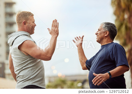 High five, hand shake and senior friends in the city outdoor for a workout, exercise or running. Teamwork, motivation and success with a mature man and friend in celebration of a training goal 129712012