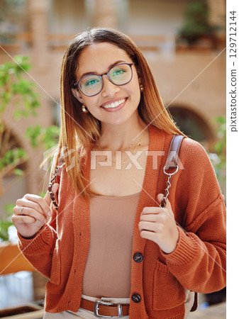 Student, woman with smile in portrait, university and education, scholarship and outdoor with learning and study. College student, academic growth and happy with glasses and geek on campus Student, woman with smile in portrait, university and education, scholarship and outdoor with learning and study. College student, academic growth and happy with glasses and geek on campus 129712144