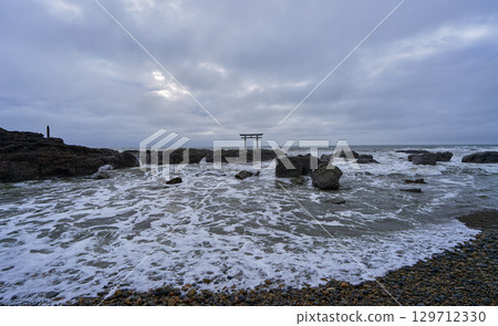 Torii gate surrounded by waves at Oarai Isosaki Shrine Torii gate surrounded by waves at Oarai Isosaki Shrine 129712330