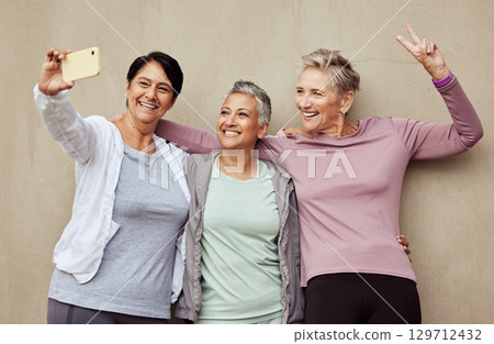 Phone selfie, senior women and peace sign fitness for exercise training, workout motivation or happy sports lifestyle. Elderly friends, smile and smartphone photography for strong woman athletes 129712432