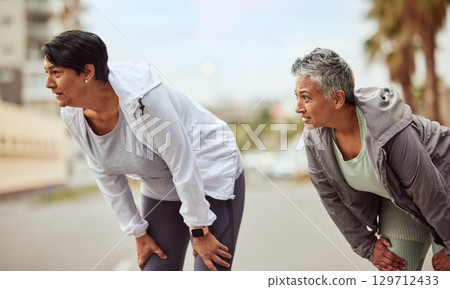 Tired, running and friends with women in city training for stamina, endurance and fitness. Workout, goal and teamwork with senior runner jogging in town for support, exercise and cardio 129712433