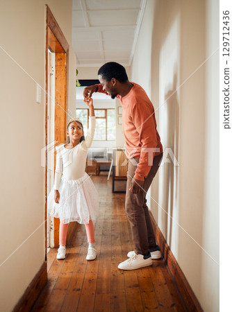 Dance, happy and ballet father and daughter holding hands for learning, support and bonding. Princess, teaching and music with dad and girl in black family home for freedom, wellness and helping 129712436