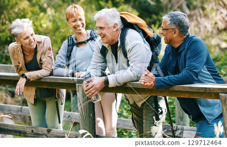 Elderly, people hiking and happy in park with fitness outdoor, relax on bridge while trekking in nature together. Health, wellness and hiker group, sport and active lifestyle motivation with cardio. 129712464