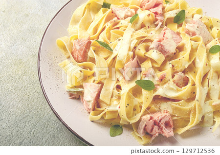 tagliatelle pasta, in cream sauce with salmon, homemade, no people, 129712536
