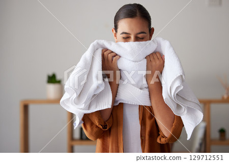 Laundry, fresh and woman smelling a towel after cleaning, housework and washing clothes in the morning. Chores, housekeeping and cleaner with smell of clean clothing after a routine wash at home Laundry, fresh and woman smelling a towel after cleaning, housework and washing clothes in the morning. Chores, housekeeping and cleaner with smell of clean clothing after a routine wash at home 129712551